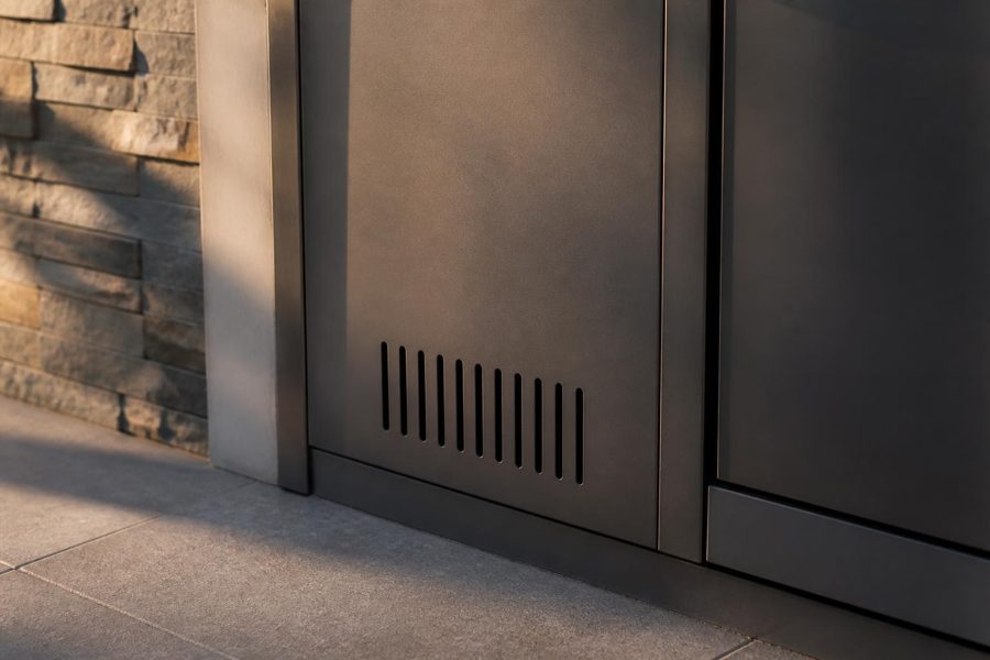 Low vent slots cut into the door of an outdoor kitchen propane tank cabinet